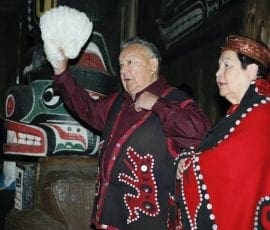 The keeper of hundreds of Kwakwaka’wakw songs, Kwaksistalla Wathl’thla (Clan Chief Adam Dick), chanting at a feast (qui’las) with Mayanilh (Dr. Daisy Sewid-Smith).